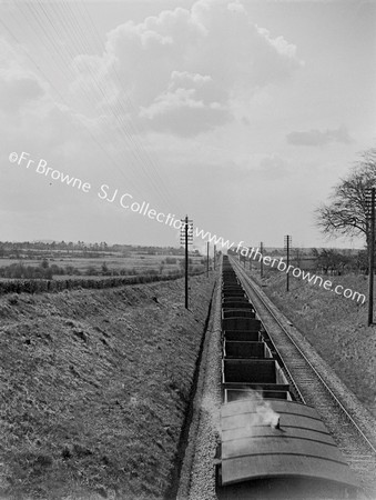 LOOKING DOWN ON GOODS TRAIN FROM BRIDGE